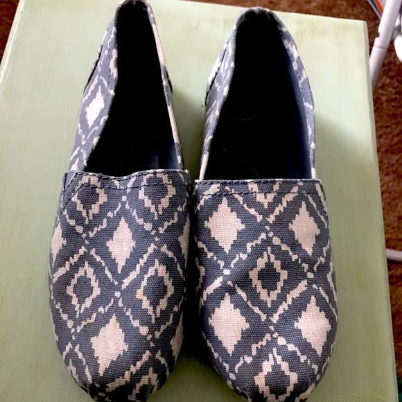 SO blue and white ikat patterned slip on shoes